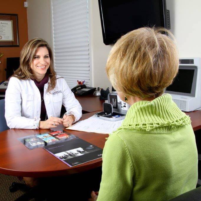 Audiologist with Patient